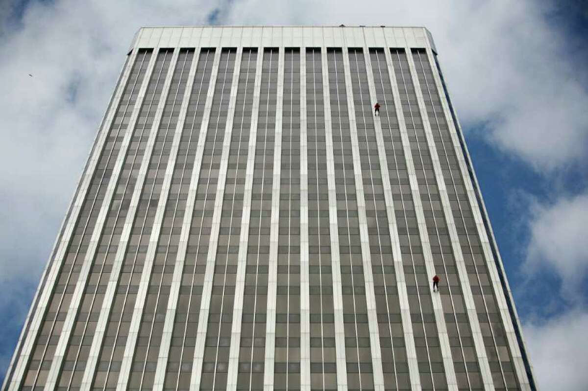 People descend Seattle's 41-story Rainier Square Tower during Over the Edge.
