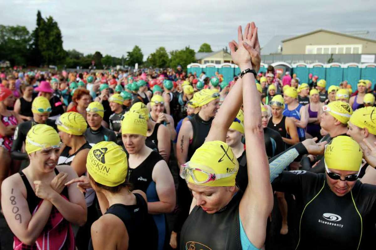 Swimmers prepare to start the race at the Danskin Triathlon at Genesee Park in Seattle on Sunday, Aug. 14, 2011.