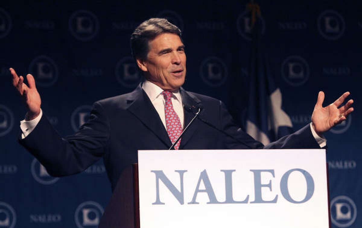 Gov. Rick Perry addressed Hispanics from around the country at a conference Thursday in San Antonio.
