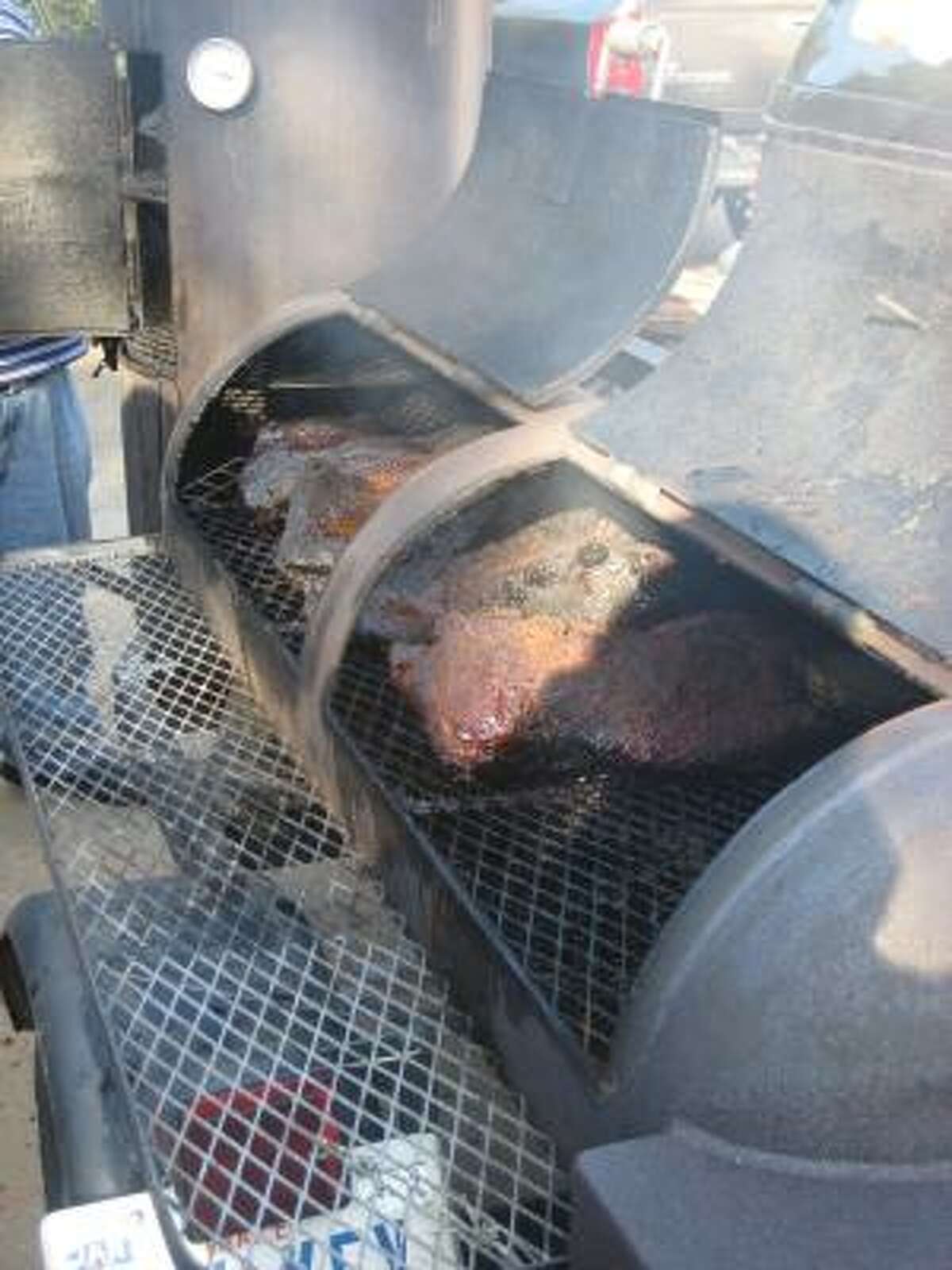 A beef brisket is in the smoker at Foodways Texas and Texas A&M's barbecue summer camp.