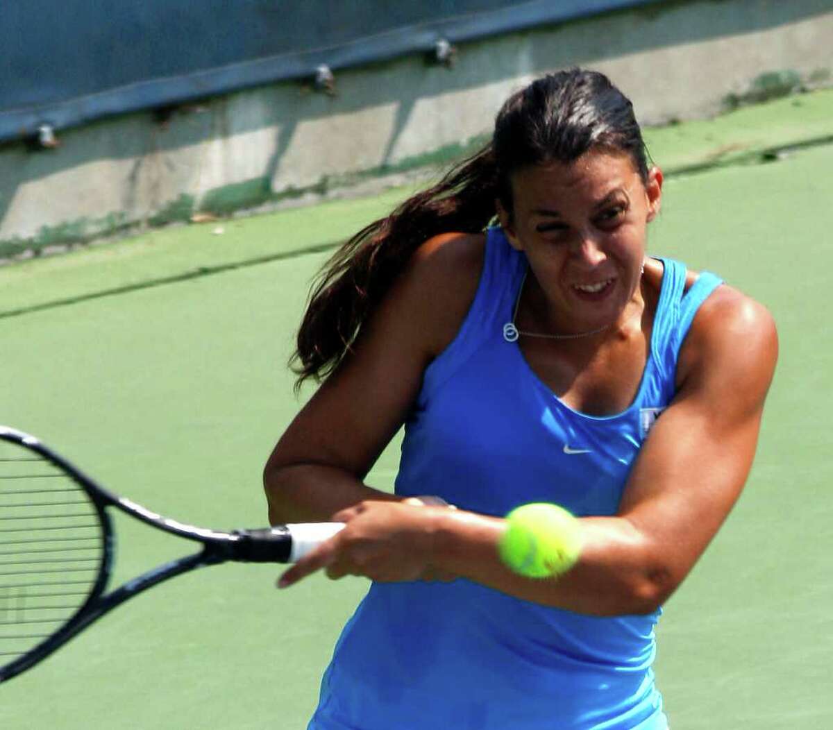 Marion Bartoli, from France, returns a volley to Daniela Hantuchova, from Slovakia, during a match at the Western & Southern Open tennis tournament, Thursday, Aug. 18, 2011, in Mason, Ohio. (AP Photo/David Kohl)