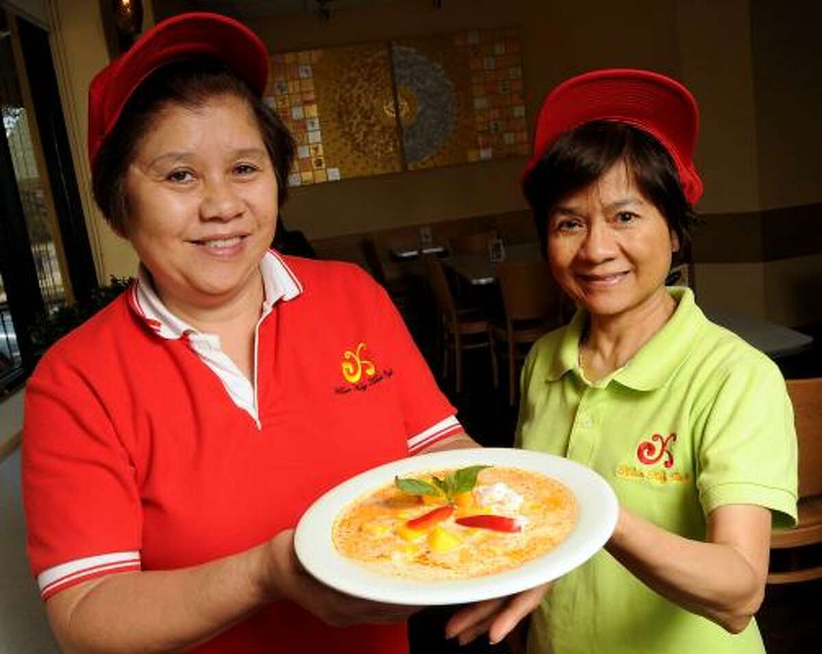 Co-owners chef Kay Soodjai and Supatra Yooto are proud of their mango curry dish at Khun Kay Thai Cafe on Montrose, but a shortage of Thai coconut milk is hurting the bottom line. The cost for a case of the ingredient has doubled. The sisters in law have sold the restaurant to new owners who are assuming the business Jan. 1, 2016.