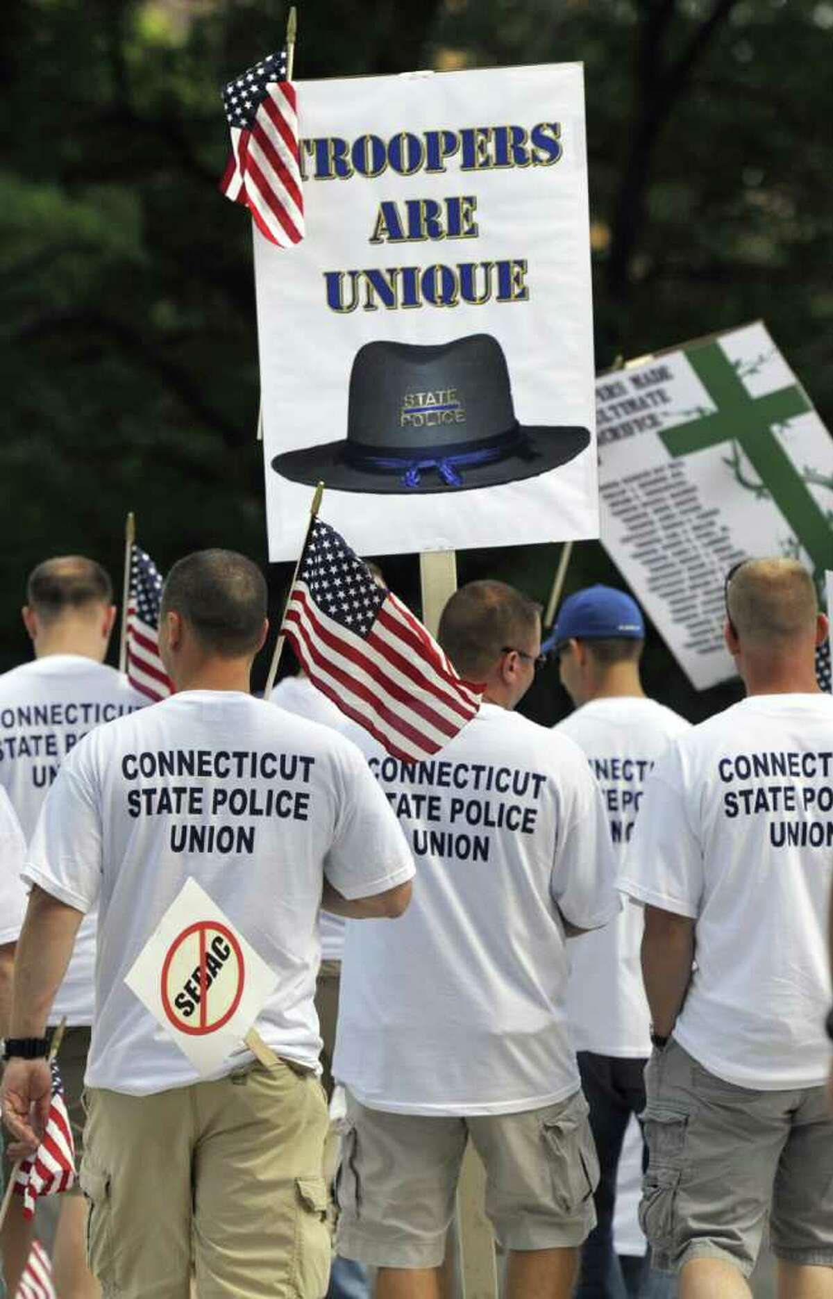 The Connecticut State Police Union holds a rally at the Capitol in Hartford, Conn., Monday, Aug. 22, 2011. Union leaders say state police are already understaffed and cutting 56 troopers is a dangerous proposal that could result in slower emergency response times. (AP Photo/Jessica Hill)