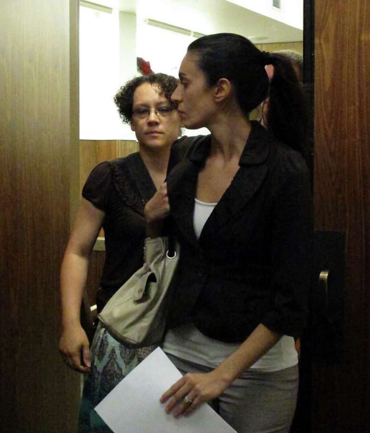 Jessica Beagley, 36, left, leaves court on Tuesday, Aug. 23, 2011, in Anchorage, Alaska, with an unidentified woman. A jury convicted her of misdemeanor child abuse for squirting hot sauce into the mouth of her adopted Russian son as punishment in what prosecutors said was a ploy to get on the "Dr. Phil" TV show. (AP Photo/Mark Thiessen)