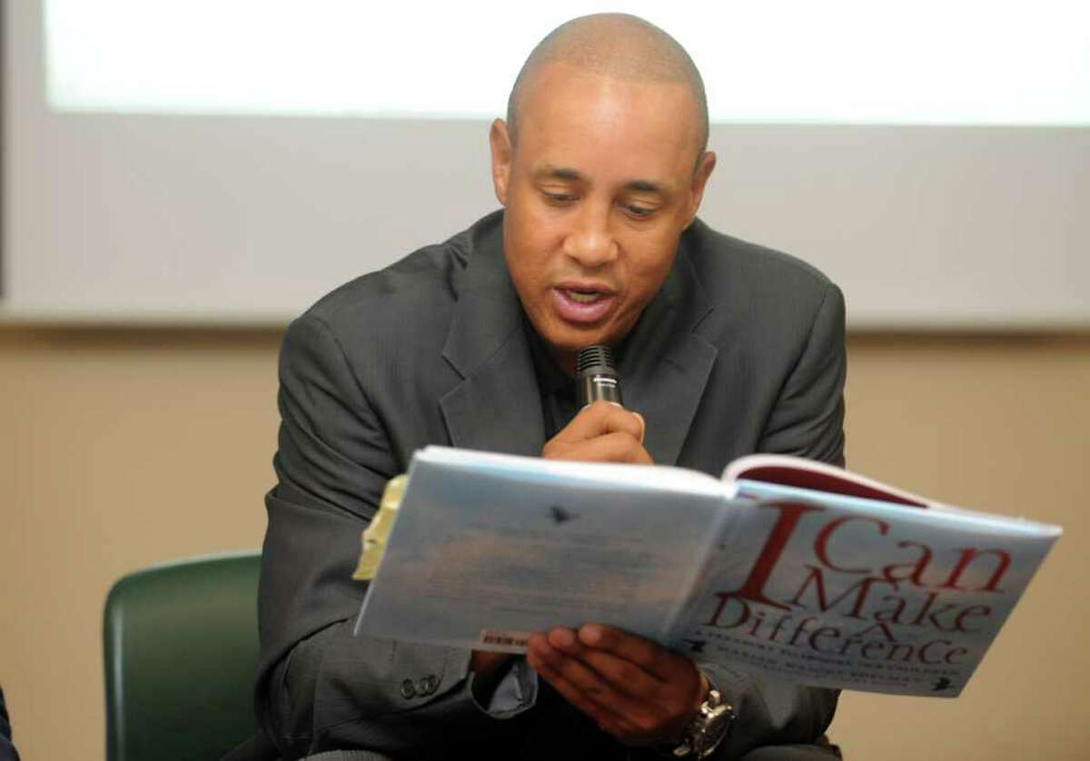 Former Knicks superstar John Starks reads an excerpt from the childrenís book "I Can Make a Difference," by Marion Wright-Edelman, Tuesday, Aug. 23, 2011 during Cablevisionís 2011 Knicks Read to Achieve program at South Norwalk Library.