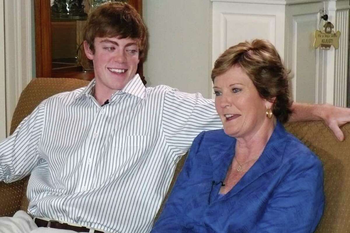 In a Monday photo provided by the University of Tennessee, Tennessee women's basketball coach Pat Summitt sits next to her son, Tyler Summitt, at her Knoxville, Tenn. home. Summitt was recently being diagnosed with early onset dementia.