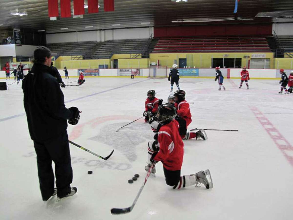 Youth hockey players from New Canaan and Darien participate at the week-long North American Hockey School Summer Camp at the Terry Connors Ice Rink it Stamford.