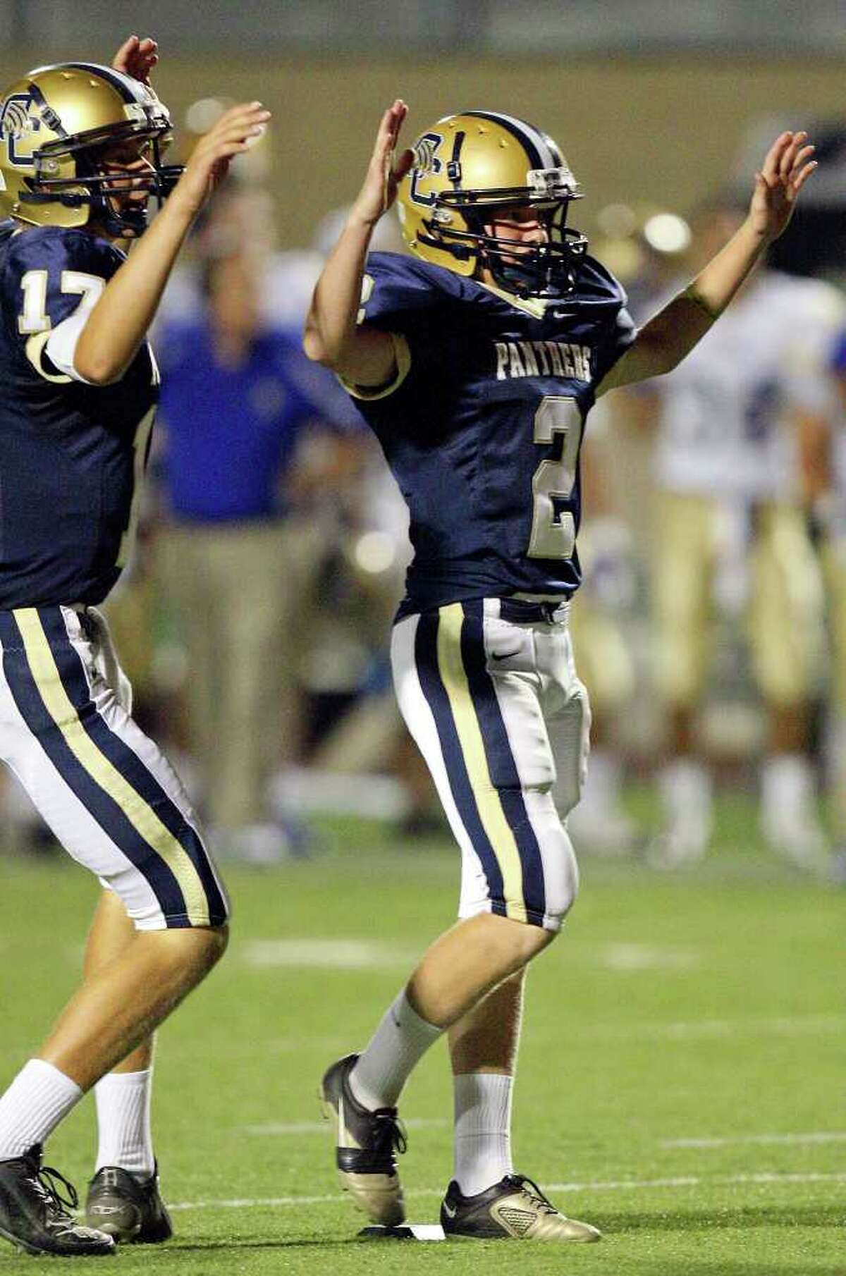 O'Connor's Troy Thienpont (left) celebrates with teammate O'Connor's Dillon Westall after Westall kicked a field goal to tie the game 20-20 against Alamo Heights late in the fourth quarter Saturday Aug 27, 2011 at Farris Stadium. O'Connor won in double overtime 28-27.