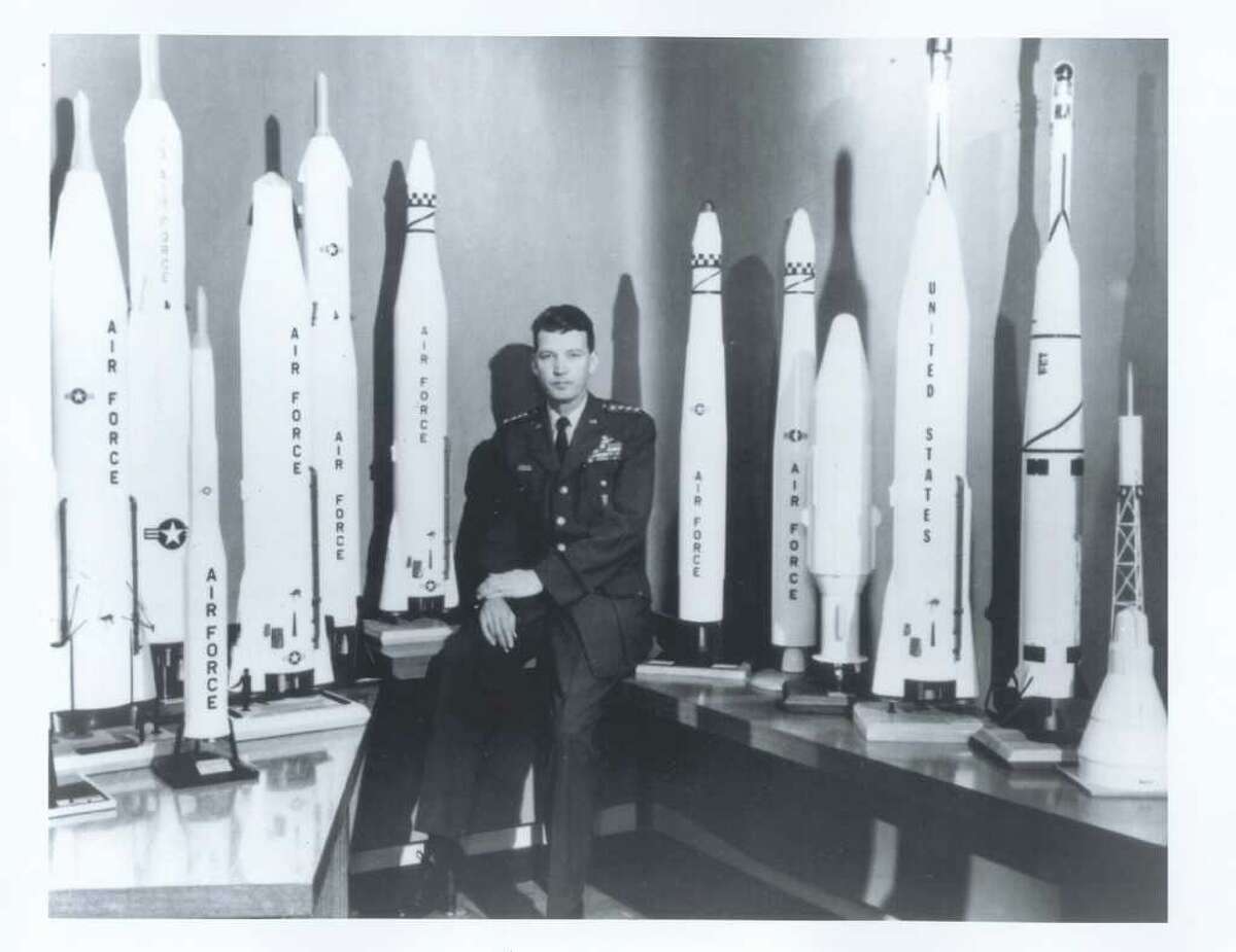 Gen. Bernard Schriever sits amid a sea of missile models. Schriever engineered the Intercontinental Ballistic Missile program and its Minuteman weapons during the Cold War.