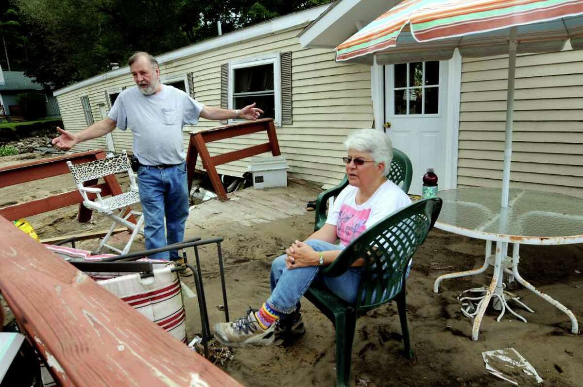 Residents Jane Martin, right, and John Hudson talk about the Gulf Brook rising and the damage to their home on Tuesday, Aug. 30, 2011, in Keene, N.Y. (Cindy Schultz / Times Union)