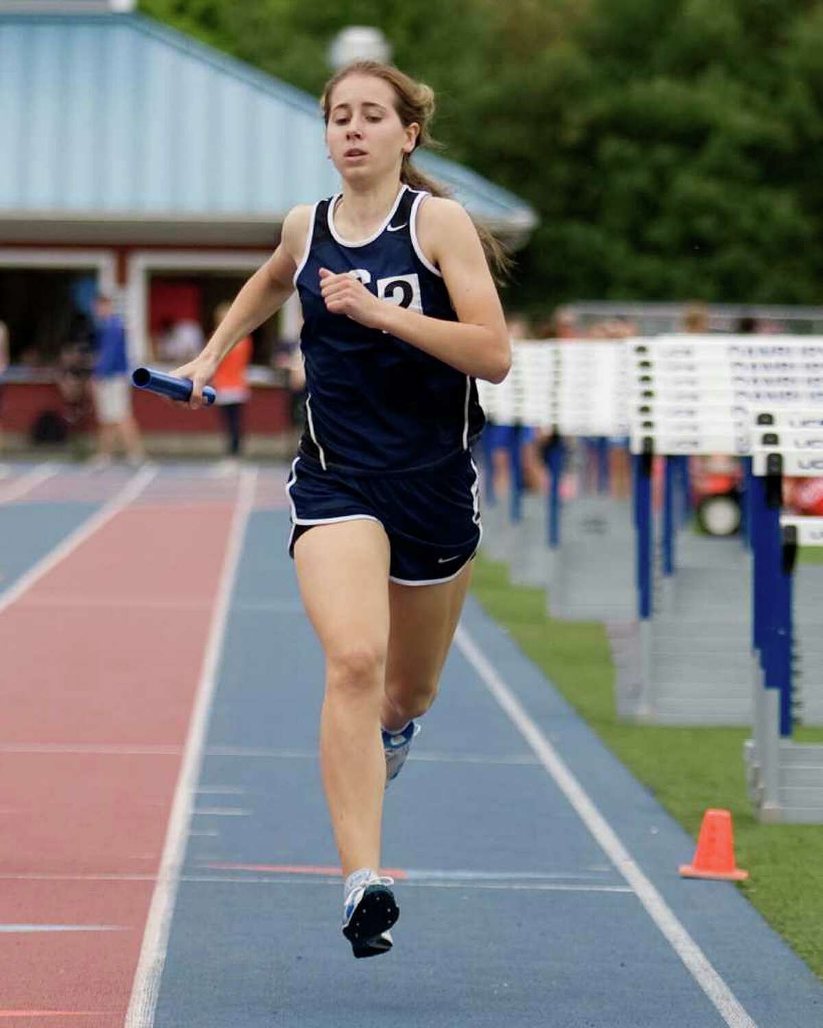 Ingrid Johnson anchors Staples' 4x800 meter relay team to victory at the FCIAC championships. Johnson is credited for helping her teammates qualify for the New England championships and will run cross country and track at Johns Hopkins University.