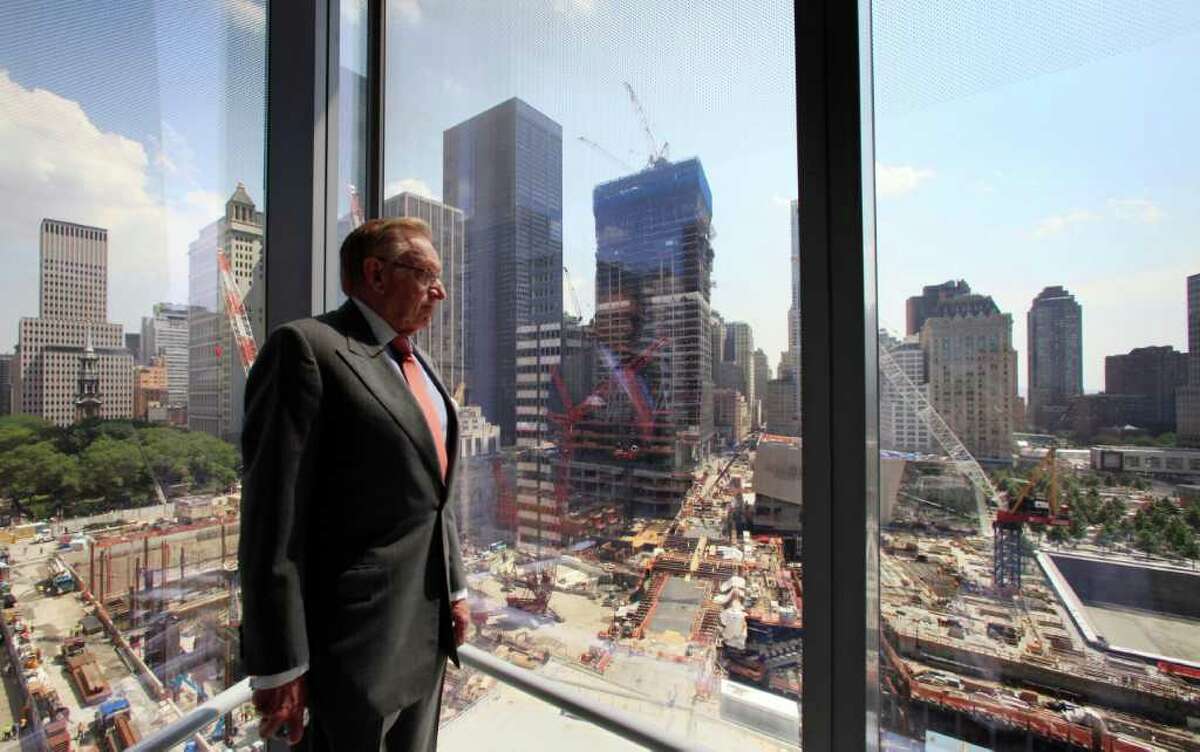 In this July 19, 2011 photo, developer Larry Silverstein looks out from his office tower, 7 World Trade Center, at the ongoing construction of the World Trade Center site in New York. His company, Silverstein Properties, is constructing three office towers at the site that was ravaged in the attacks of Sept. 11, 2001. (AP Photo/Mark Lennihan)