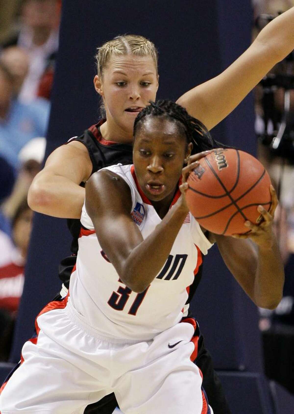 Connecticut's Tina Charles (31) moves in on Stanford's Jayne Appel in the first half in a semifinal of the NCAA women's college basketball tournament Final Four on Sunday, April 5, 2009, in St. Louis. (AP Photo/Lynne Sladky)