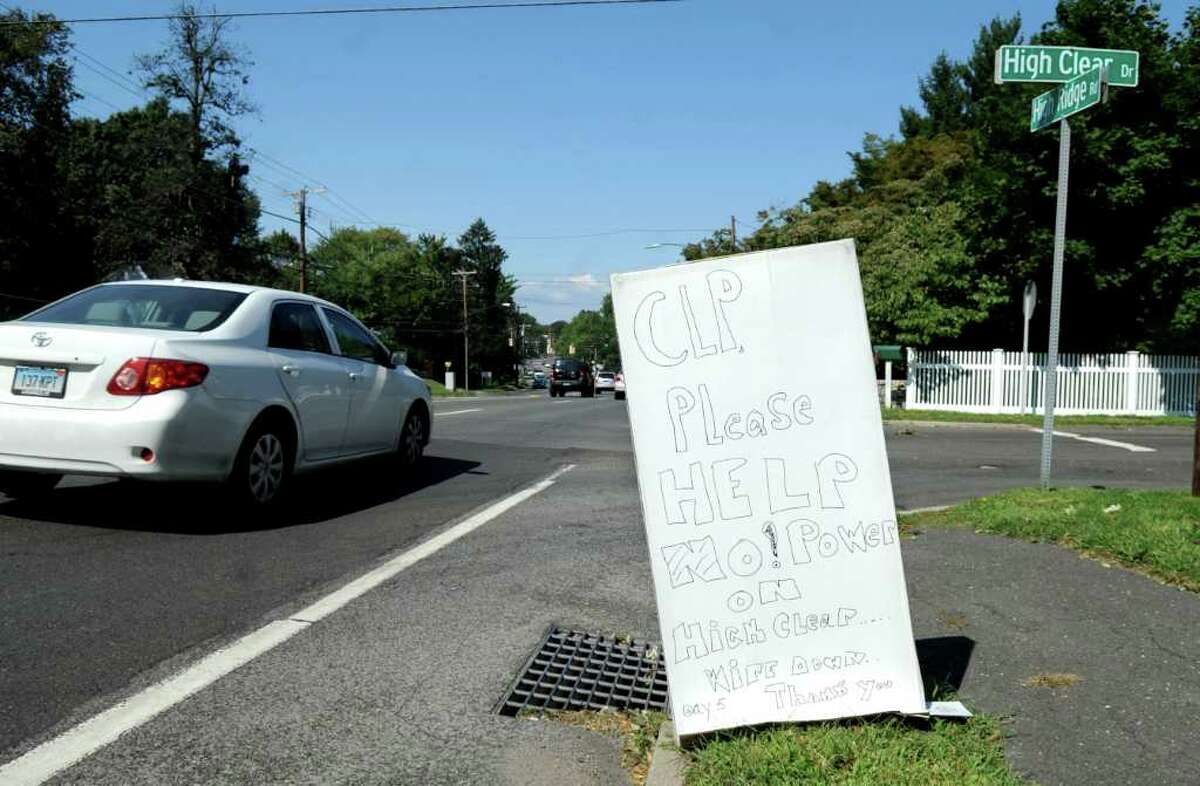 A sign pleading with Connecticut Light & Power to restore electricity along High Clear Road in Stamford stands at the intersection of High Clear and Pound Ridge Roads on Friday, September 2, 2011.