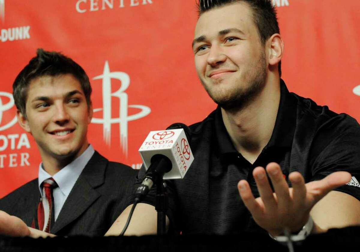 Houston Rockets new players Donatas Motiejunas, right, of Serbia, and Chandler Parsons look on during a basketball news conference, Friday, June 24, 2011, in Houston. (AP Photo/Pat Sullivan)