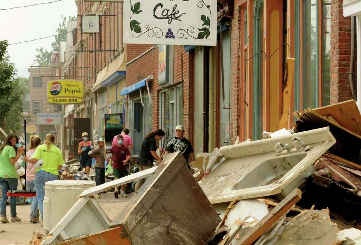 Click through the slideshow to see photos of the Capital Region after Tropical Storm Irene in 2011. Downtown businesses on Main Street continue the decontamination and clean up process in the Town of Schoharie NY Saturday Sept.3, 2011. ( Michael P. Farrell/Times Union)