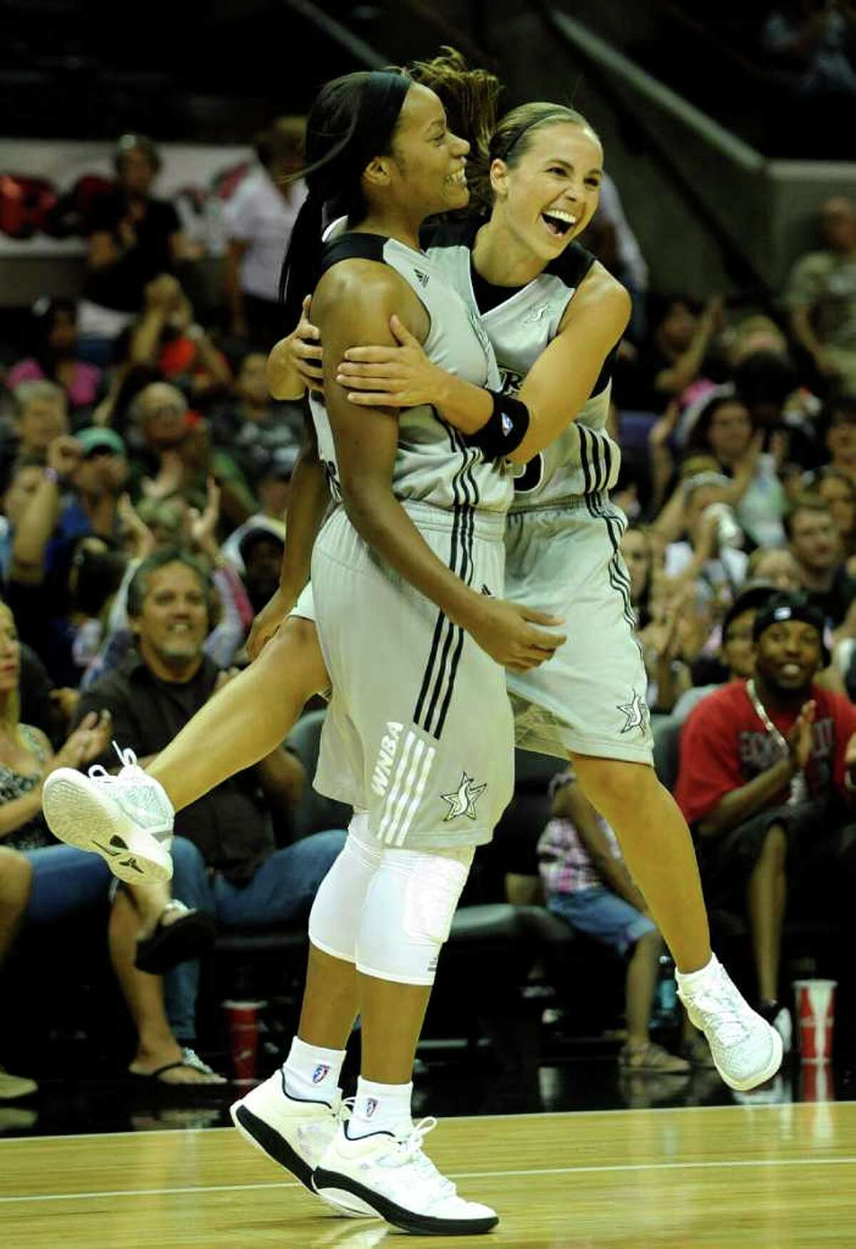 Guard Becky Hammon (right), rejoicing after a basket by Jia Perkins on Saturday against Seattle, says the Silver Stars need to take care of business to make the playoffs.