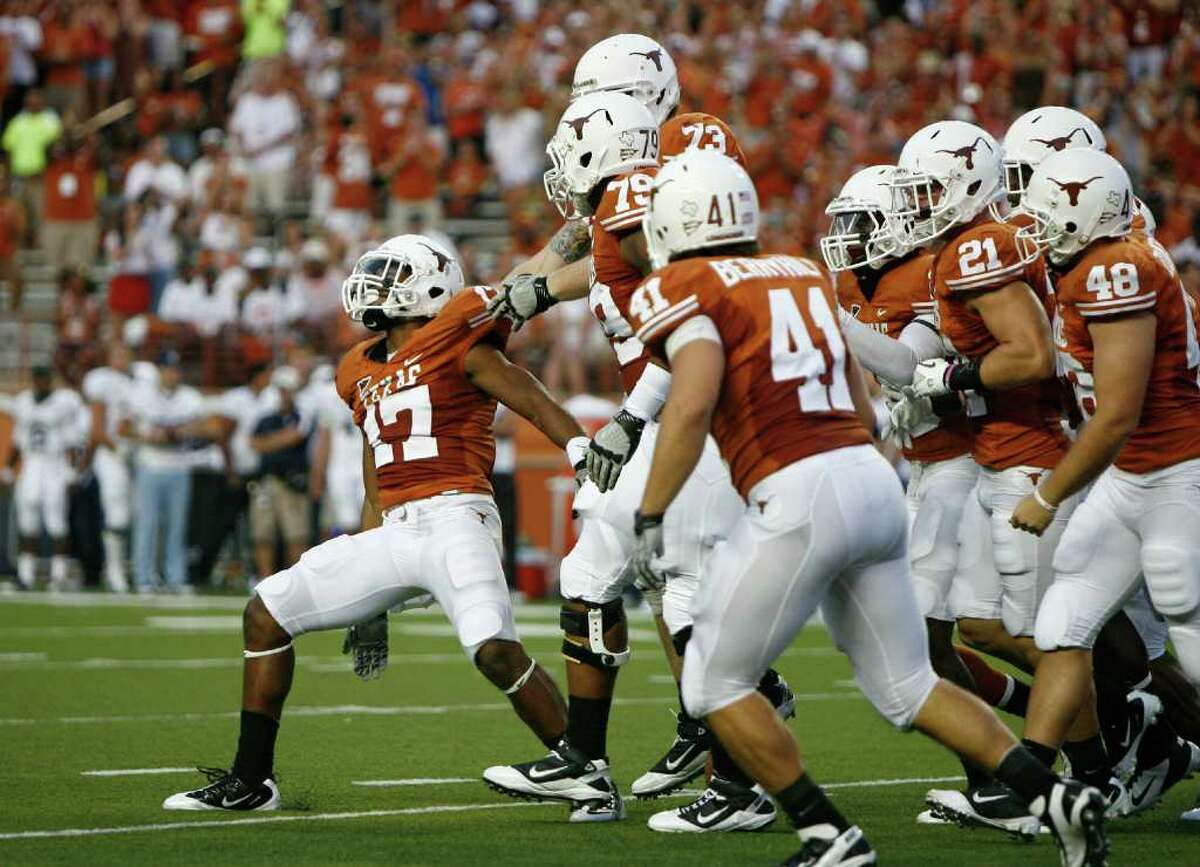 AUSTIN, TX - SEPTEMBER 3: Cornerback Adrian Phillips #17 of the Texas Longhorns celebrates a fumble recovery against the Rice Owls on September 3, 2011 at Darrell K. Royal-Texas Memorial Stadium in Austin, Texas.