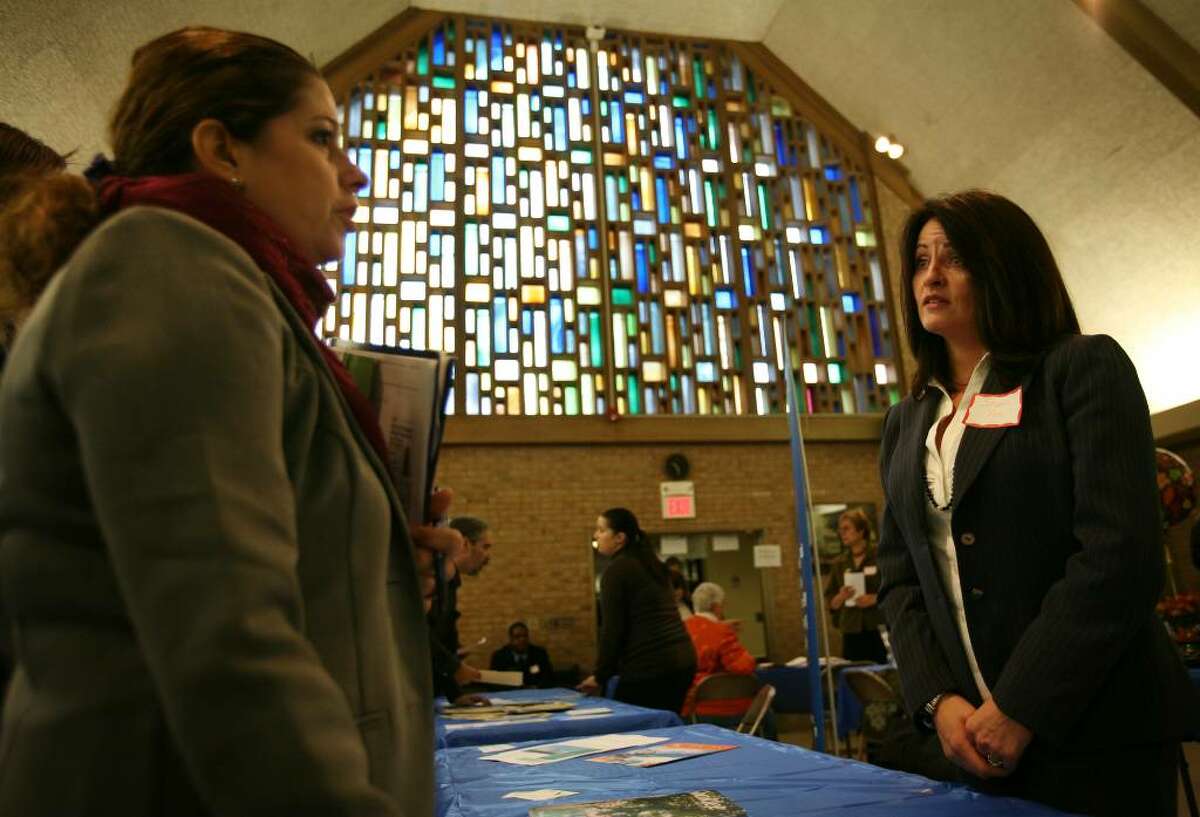 Yvette Novack, left of Stratford, talks with Shaklee representative Sharon See at the Faith for the Future Job Fair 2009 at the Christ Episcopal Church Hall at 200 Main Street in Stratford, Conn. on Thursday, October 15, 2009.