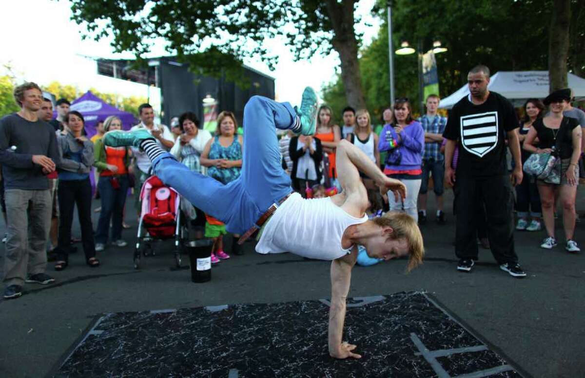Bobby Bonsey performs break dancing with the Master Blaster crew on day three of Bumbershoot at the Seattle Center.