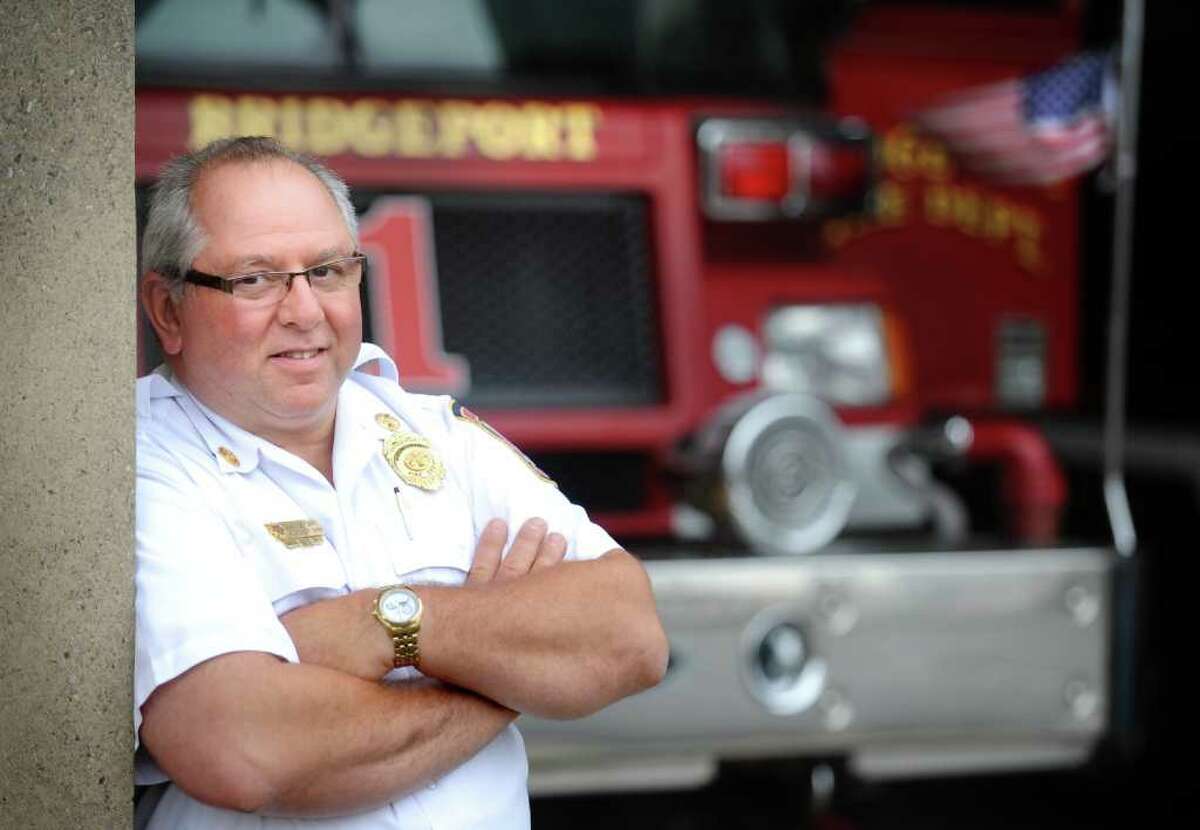 Bridgeport Assistant Fire Chief Dominick Carfi stands in the bay at the Brigeport Fire Department Wednesday, Sept. 7, 2011. Carfi volunteered at ground zero on Sept. 12, 2001. He was diagnosed with multiple myeloma in 2009 and is not sure if it is related to his work at the scene.