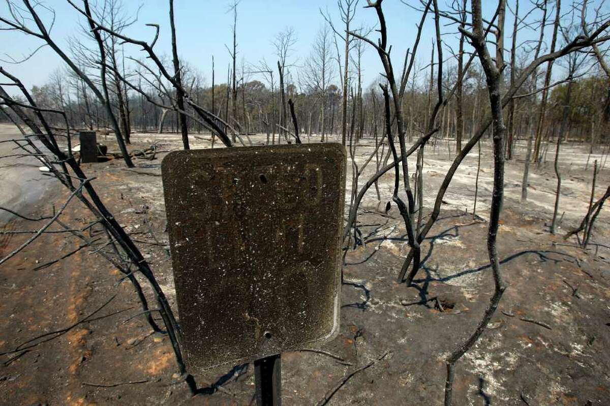 The remains of a fire-charred speed limit sign is seen Wednesday Sept. 7, 2011 in the Alum Creek area east of Bastrop aftermath of the Bastrop County Complex wildfire that charred more than 33,000 acres.