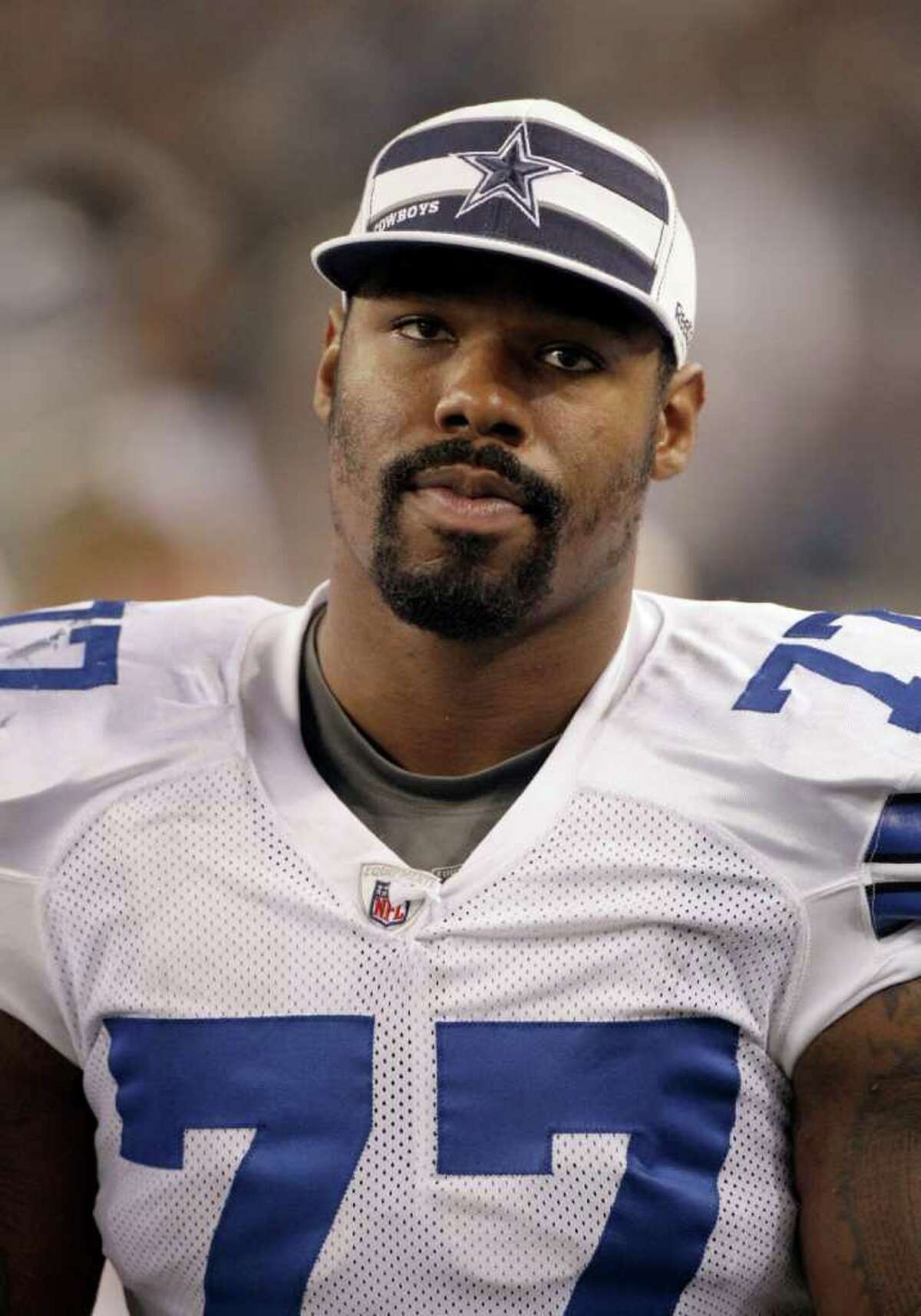Dallas Cowboys' Tyron Smith is watches action against the Denver Broncos from the sideline during a preseason NFL football game Thursday, Aug. 11, 2011, in Arlington, Texas. (AP Photo/Tony Gutierrez)