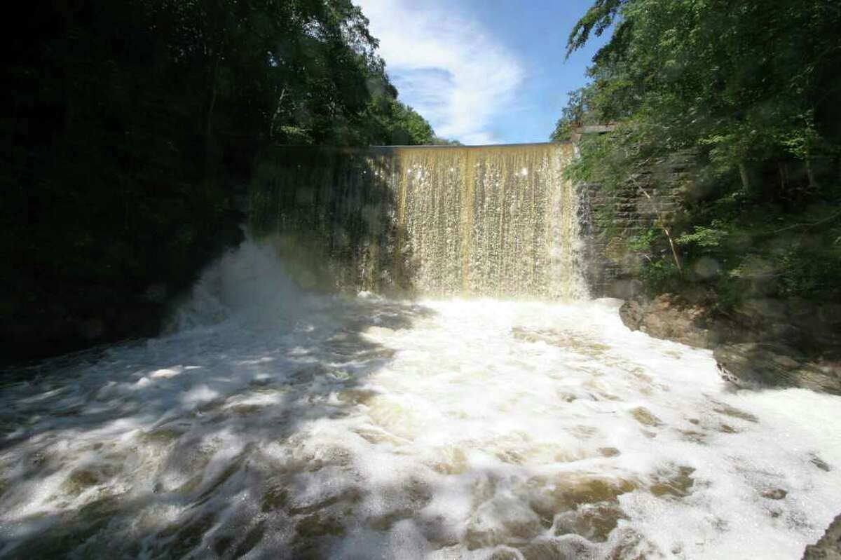 Water running over the Pemberwick Road dam, seen here Friday, Sept. 9, 2011 remains high following a week of heavy rain, starting with the remnants of Hurricane Irene a week ago.