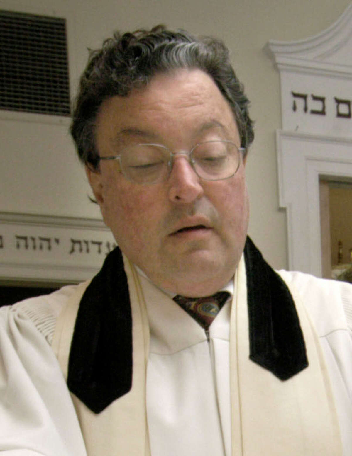 Rabbi Clifford Librach of the United Jewish Center in Danbury reads from the Torah in this News-Times file photo.