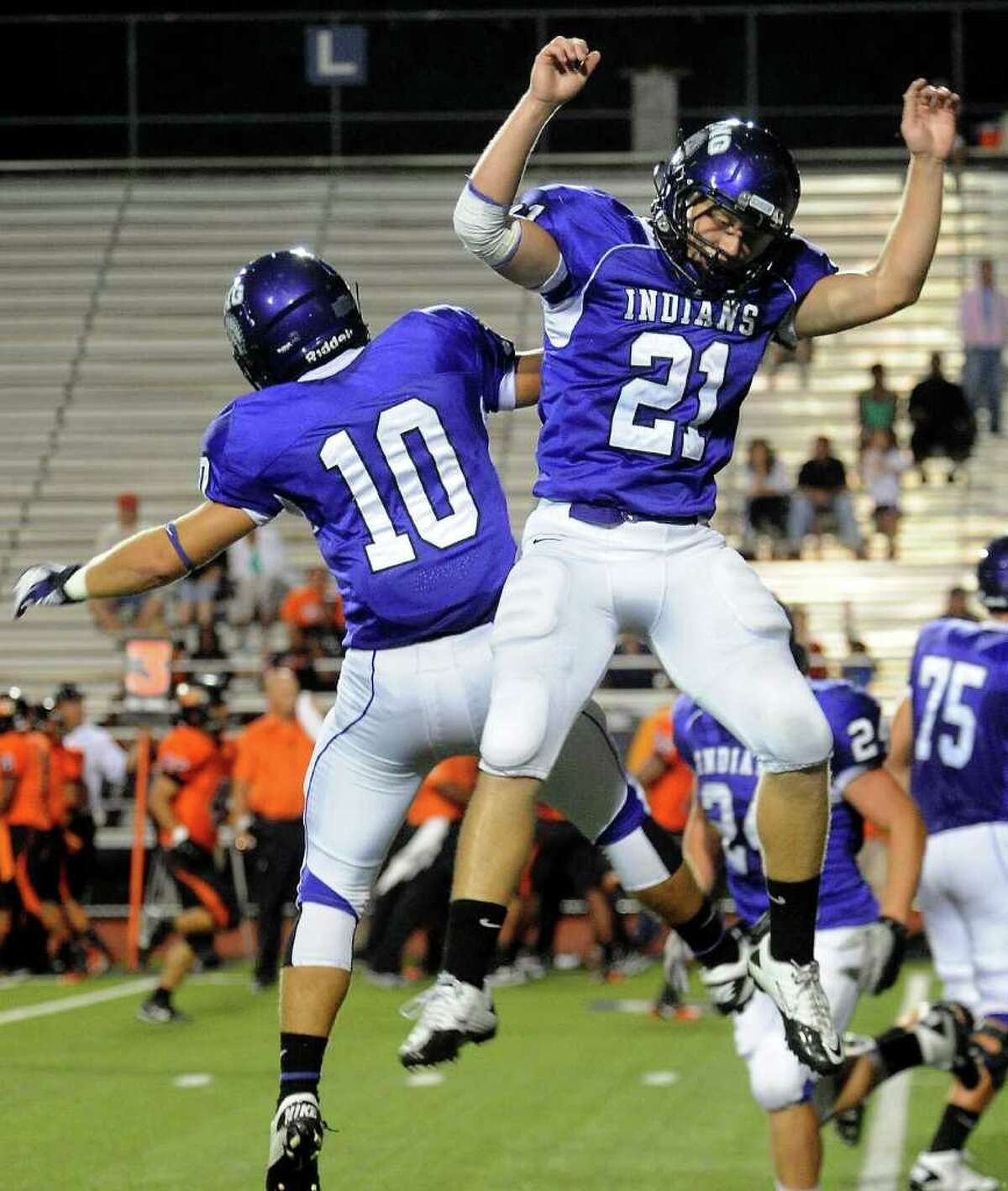 PNG's Tyler LaCour and Justin Sperl celebrate a touchdown made by Sperl during the game against Texas City at PNG High School in Port Neches, Friday, September 9, 2011. Tammy McKinley/The Enterprise