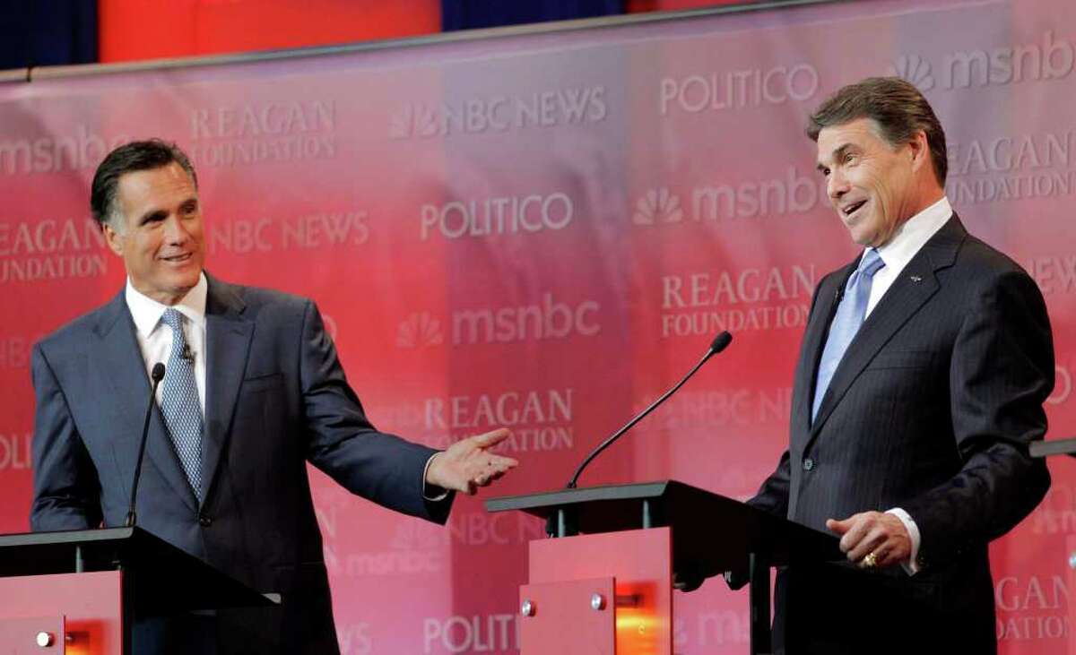 Republican presidential candidates former Massachusetts Gov. Mitt Romney, left, and Texas Gov. Rick Perry answer a question during a Republican presidential candidate debate at the Reagan Library Wednesday, Sept. 7, 2011, in Simi Valley, Calif. (AP Photo/Jae C. Hong)