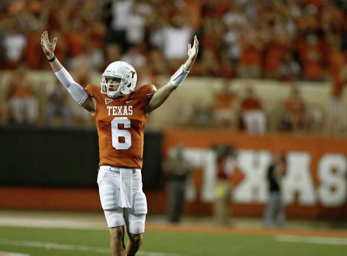 AUSTIN, TX - SEPTEMBER 10: Backup quarterback Case McCoy #6 of the Texas Longhorns signals victory over BYU Cougars as time runs out on September 10, 2011 at Darrell K. Royal-Texas Memorial Stadium in Austin, Texas. Texas defeated BYU 17-16.