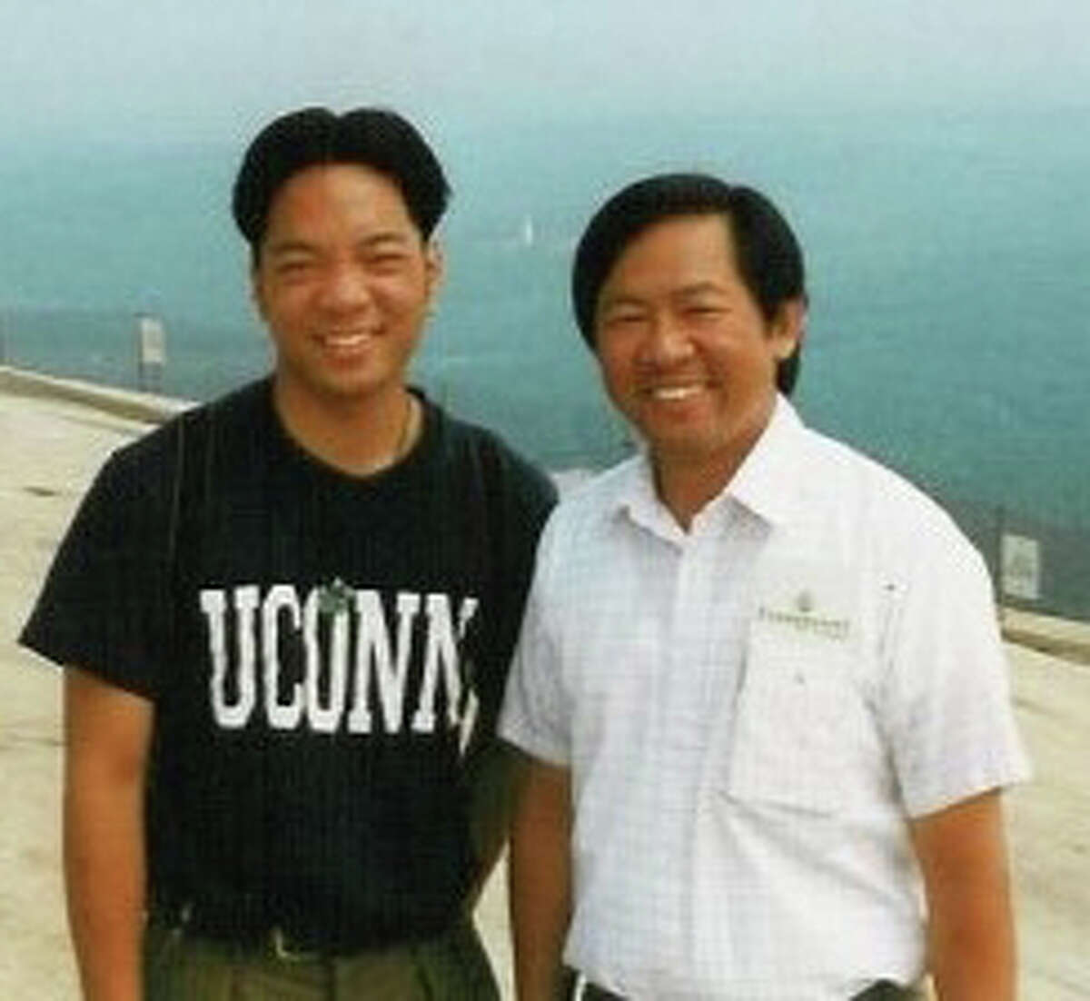Fred Kuo, left, poses with his late father, Fred, at Stone Mountain in Georgia in 1997.