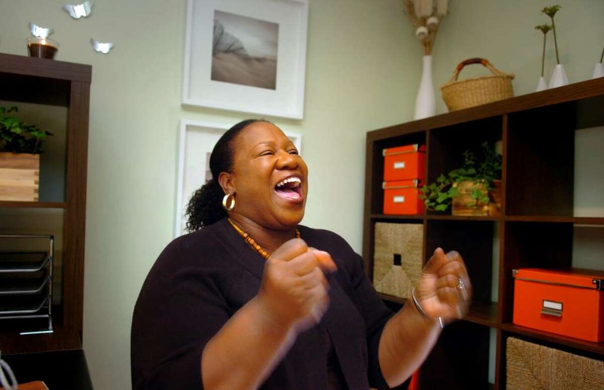 Nancy Kingwood gets excited over all the new features in her once crowded closet turned tranquil reading room in her Bridgeport home. Soroptimist International of Greater Bridgeport chose Kingwood, who is the HIV Program Coordinator for the Greater Bridgeport Adolescent Pregnancy Program, as the recipient of the "Her Haven" project and converted the room into a "haven" for the hard-working woman.