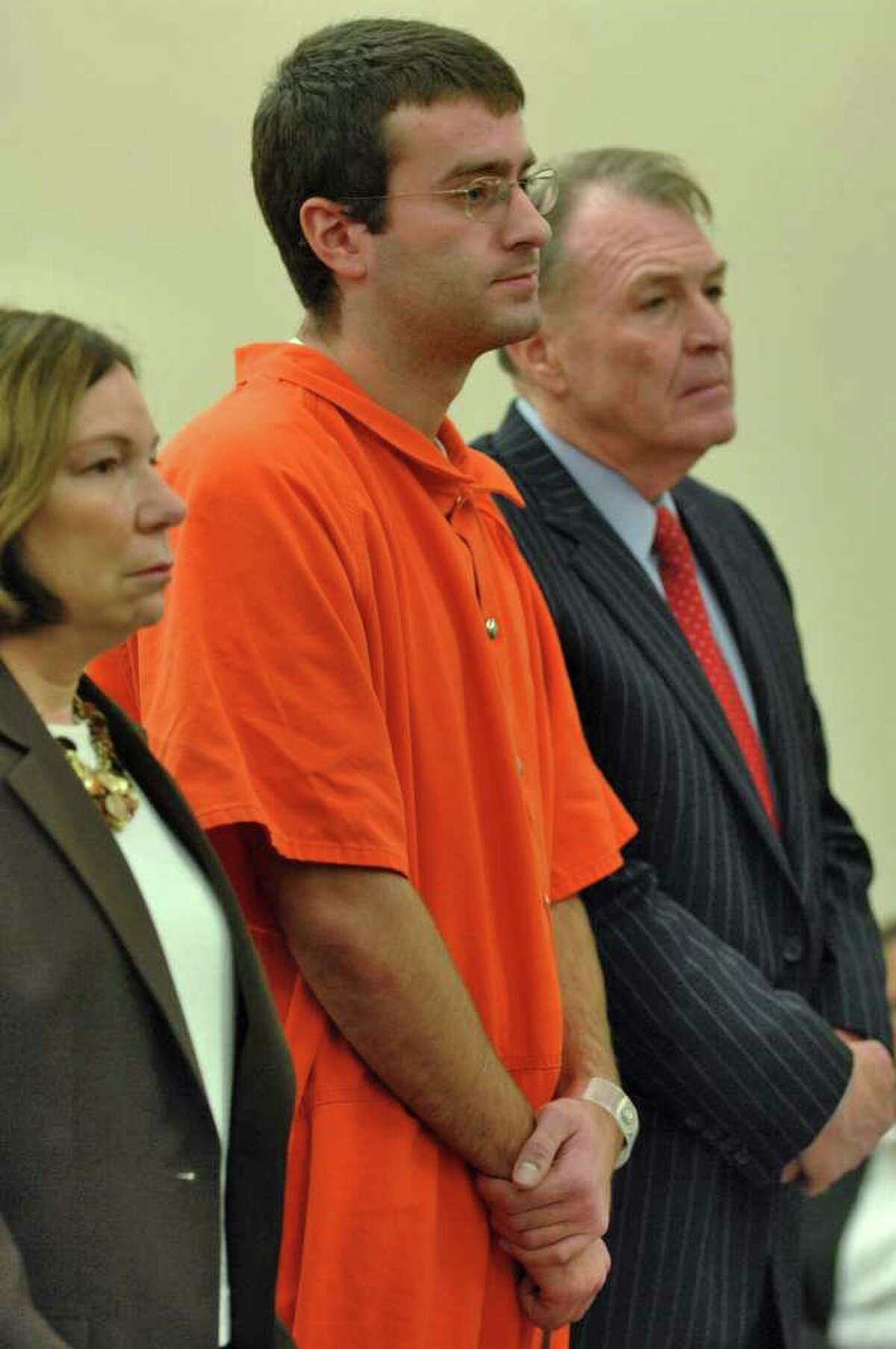 Christopher Porco, center, stands next to his attorneys, Laurie Shanks and Terence L. Kindlon, as he is sentenced in December 2006 to 46 years to life in prison for the murder of his father and the attempted murder of his mother. (Times Union/Philip Kamrass)