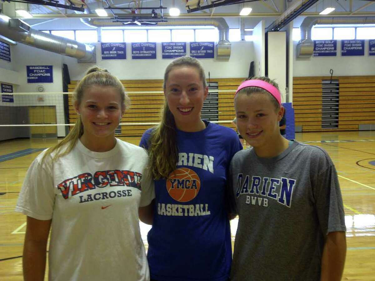 From left, Darien volleyball captains Charlett Stevenson, Katie Stueber and Amanda Sommi lead the defending FCIAC champion Blue Wave into the 2011 season.