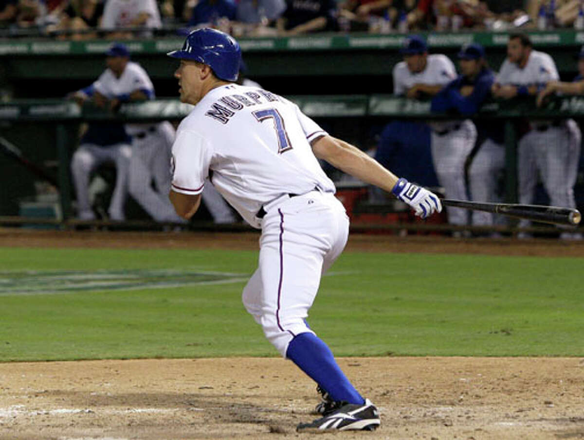 Texas Rangers' David Murphy follows through on his double to left off a pitch from Cleveland Indians relief pitcher Zach Putnam in the seventh inning of a baseball game Tuesday, Sept. 13, 2011, in Arlington. Murphy had two home runs in the 10-4 Rangers win.