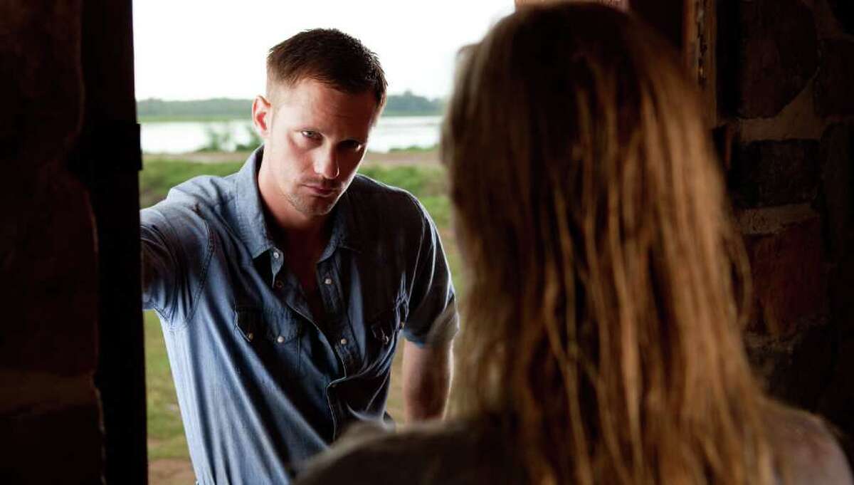 Alexander Skarsgard as "Charlie" and Kate Bosworth as "Amy Sumner" in Screen Gems' STRAW DOGS.