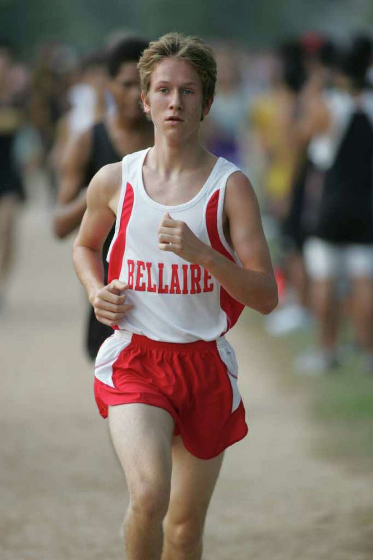 Kimball Streeter of Bellaire races cross country. Join Bellaire High School runners at the run run and auction Saturday.