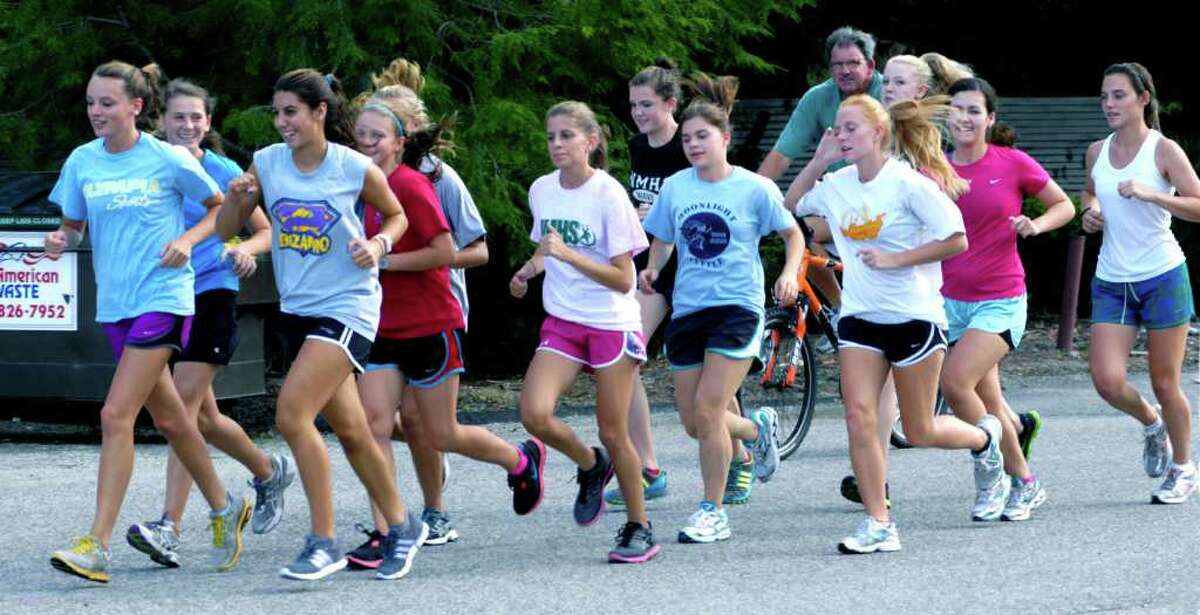 SPECTRUM/The defending South-West Conference champion New Milford High School girls' cross country features a deep and talented lead pack as it preps for the 2011 campaign. September 2011