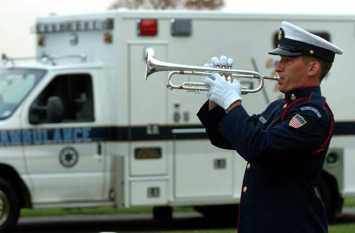 U.S. Coast Guard First Class petty Officer Joel Baroody plays taps as part of a Ceremony Honoring Connecticut's 9/11 First Responders and Volunteers at Sherwood Island State Park in Westport, Conn. on Tuesday September 14, 2011.