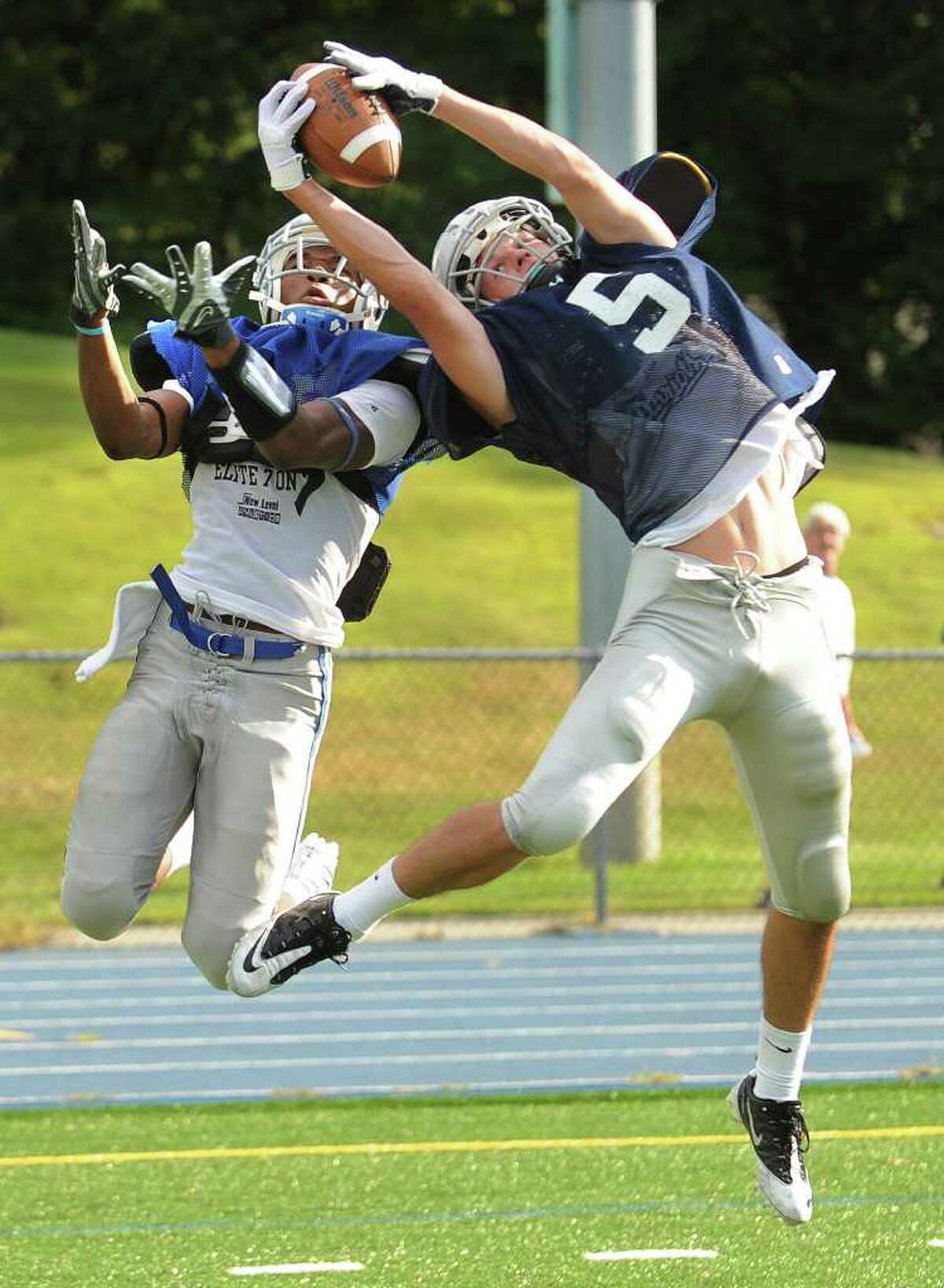 Staples DB Nick Kelly intercepts a pass intended for Bunnell's Jawad Chisholm during a scrimmage at Bunnell High School in Stratford last month.