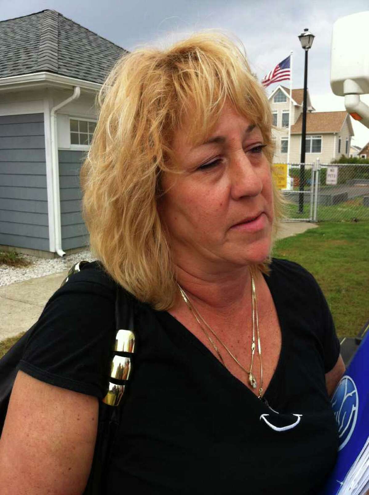 Sally Hopkins was a renter who lived some distance inland, in the center of East Haven. ìA tree fell on a line and cut the power, and when the power came back on, a surge started a fire and the house burned down,î she said while at the FEMA Disaster Recovery Center in East Haven on Thursday Sept. 15, 2011.