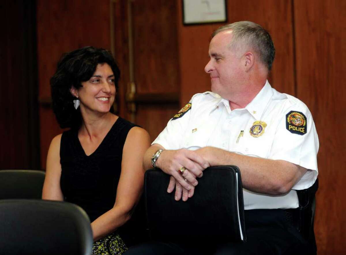 Kia Heavey smiles at her husband, Deputy Police Chief James Heavey, who received First Selectman Peter Tesei's appointment as the new police chief at Greenwich Town Hall Thursday, Sept. 15, 2011.