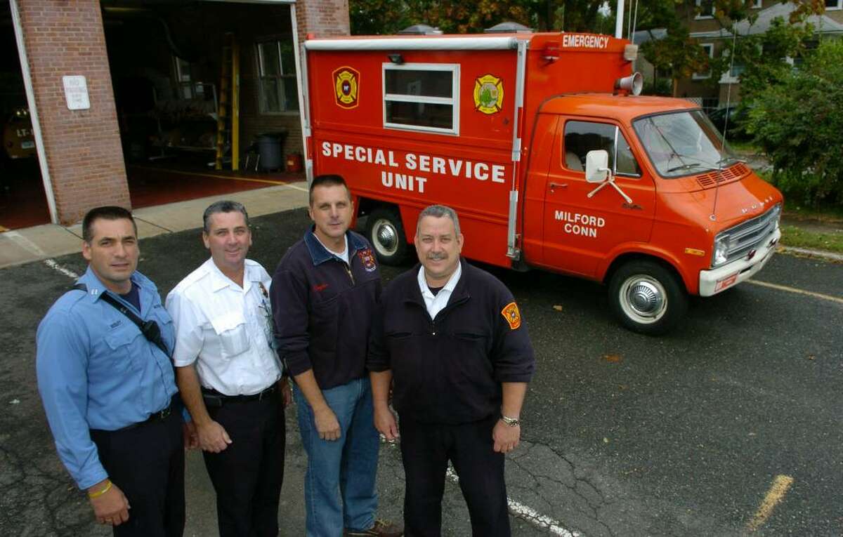 The Milford Fire Department's canteen truck from Fire Station 5 will be headed to Ridgefield FD for their use. Money was raised to purchase the truck by members of the fire explorers back in 1978. Here, several of the members who helped raise the money for the truck, pose at the station in Milford, Conn. on Friday Oct. 09, 2009. From left to right is Capt. Bernie Begley, Inspector Paul Geer, Batalion Chief Patrick Hayden, and Senior Inspector Andy Vargo.