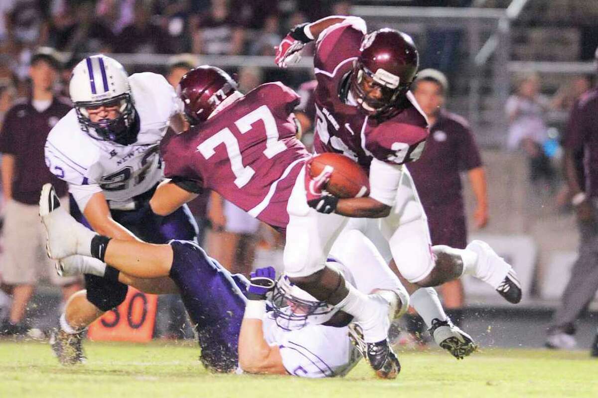 Silsbee running back Floyd Spearman (34) cuts through the Newton defense in the first half of their game at Silsbee High School on Friday, September 16, 2011. Valentino Mauricio/The Enterprise