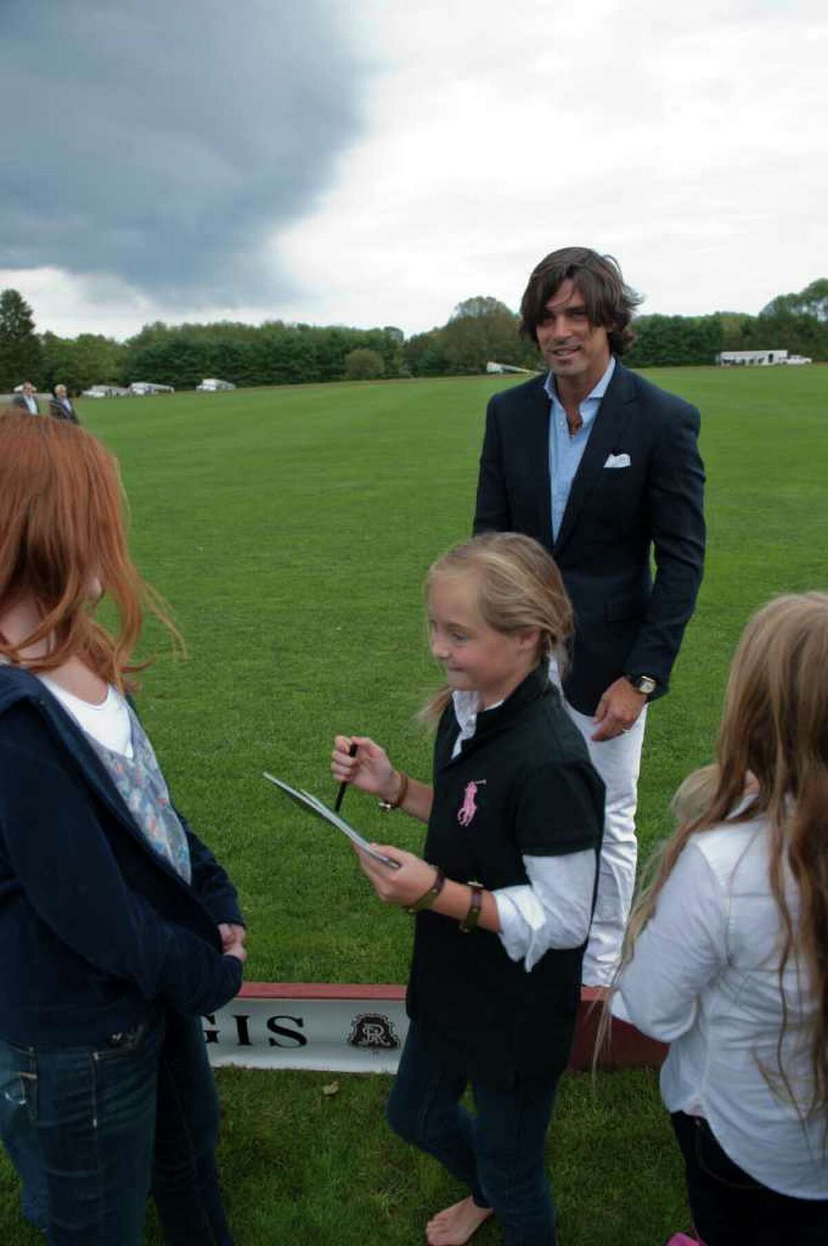 Madison Wanicka, 10, of Ridgefield, gets an autograph from Nacho Figueras, the Ralph Lauren Polo Model, on Saturday at the Greenwich Polo Club at Conyers Farm.