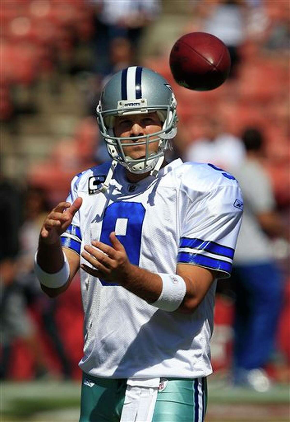 Cowboys' Romo says he'll play