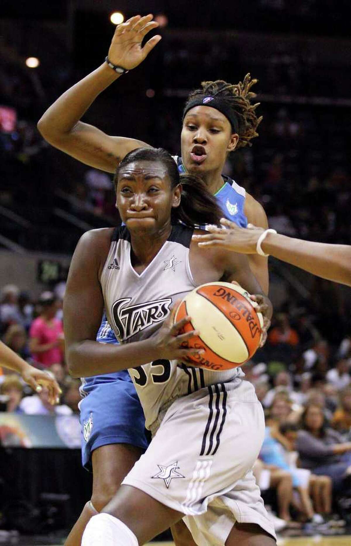 Silver Stars' Sophia Young looks for room around Minnesota Lynx's Rebekkah Brunson during second half action of Game 2 in the Western Conference semifinal Sunday Sept. 18, 2011 at the AT&T Center. The Silver Stars won 84-75.