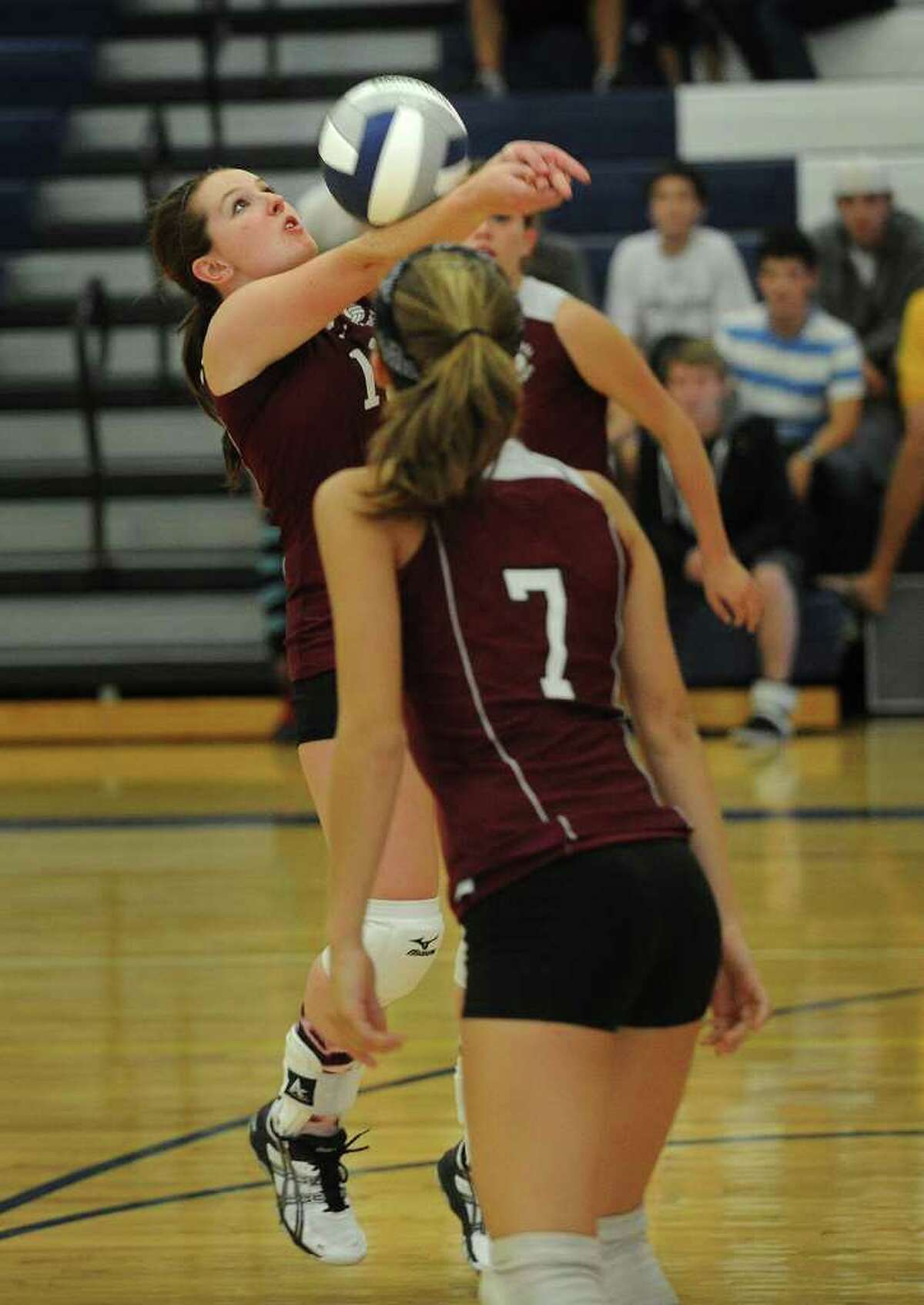 Bethel's Emily DeFazio plays the ball with her back to the net during their match at Weston High School on Monday, September 19, 2011.